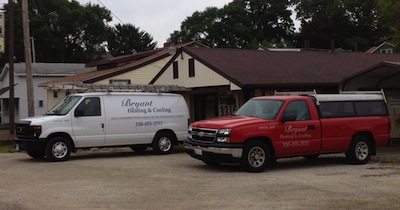 Bryant Heating and Cooling Vehicles in front of the shop, Canton Ohio.